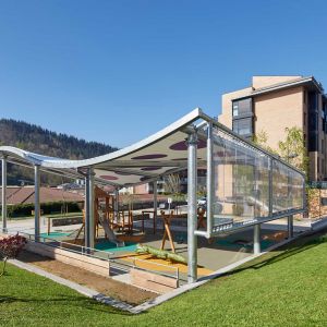 Tensioned wave-shaped structure